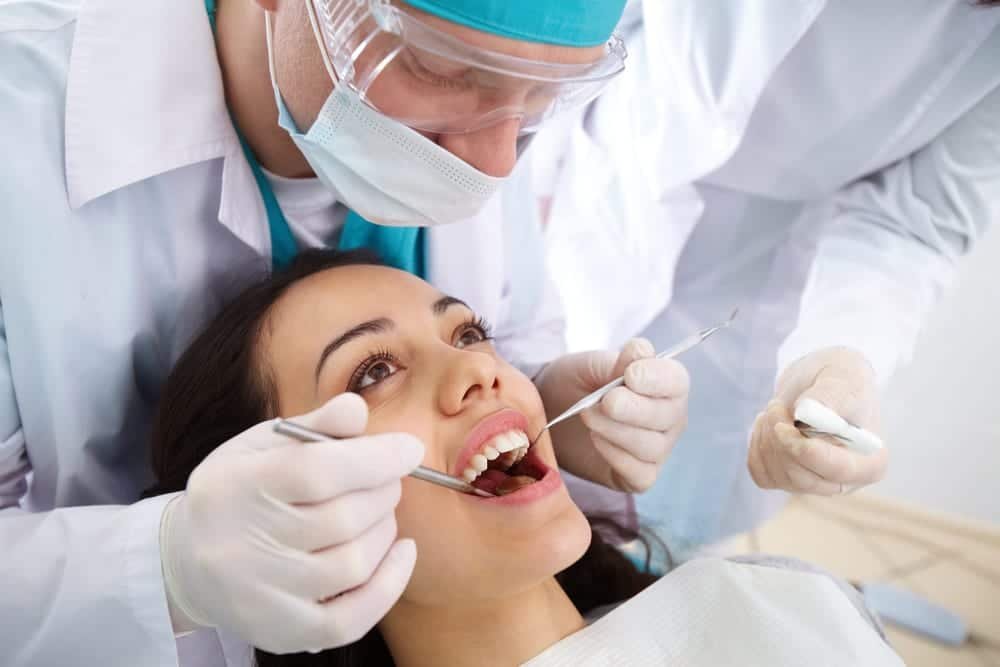Dentist examining patient